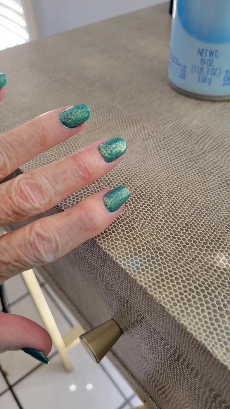Finished shimmering teal gel nails